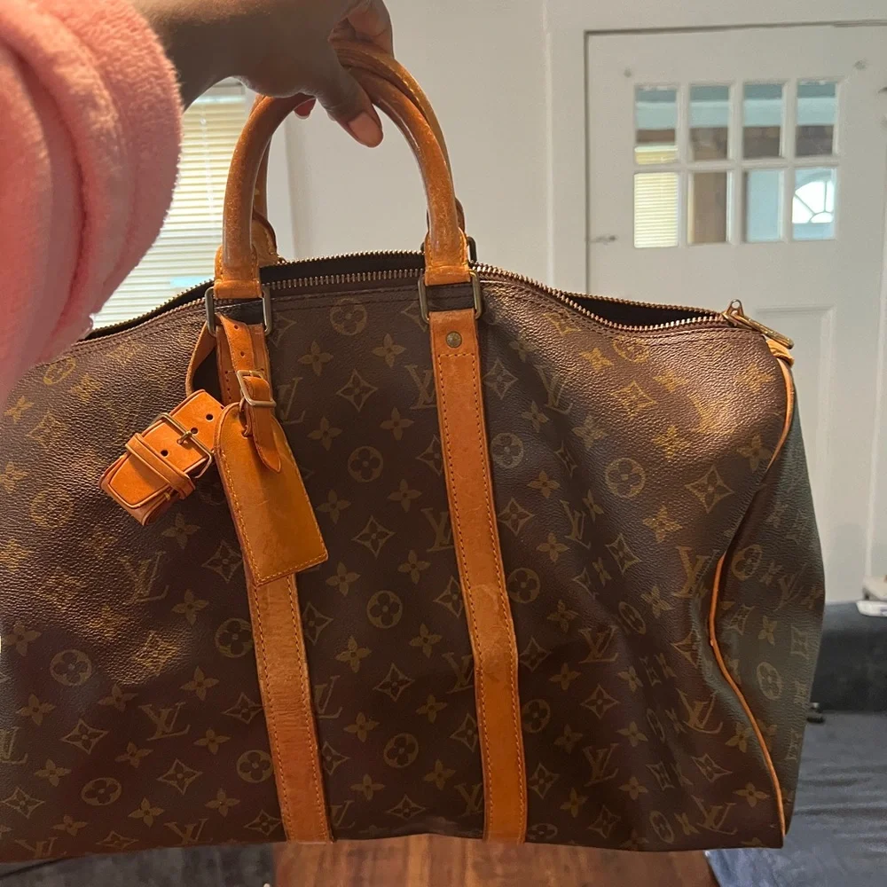 Louis Vuitton Duffle - Picture 1 of 15